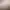Un crayon posé sur une feuille de papier à dessin avec un croquis partiel